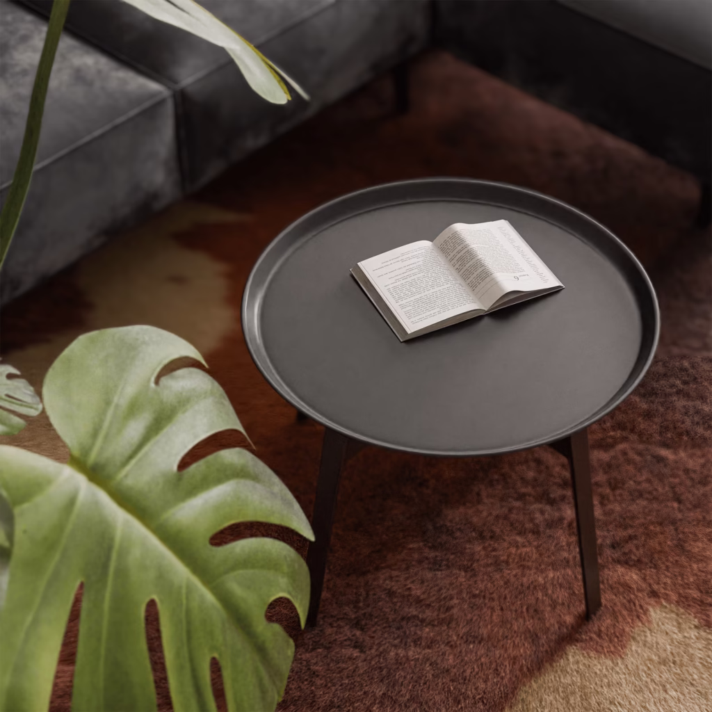 Fotorealistyczny render przedstawiający zbliżenie na stolik kawowy z książką.